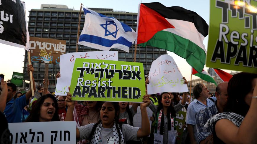 Israeli Arabs and their supporters take part in a rally to protest against Jewish nation-state law in Rabin square in Tel Aviv, Israel  August 11, 2018. REUTERS/Ammar Awad - RC1DEE0EF780