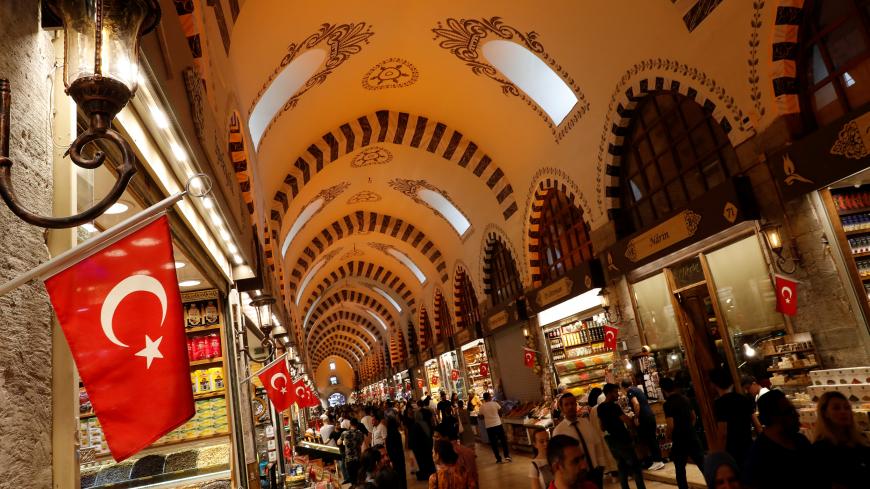 People shop at the Spice market, also known as the Egyptian Bazaar, in Istanbul, Turkey August 17, 2018. REUTERS/Murad Sezer - RC1261C678C0