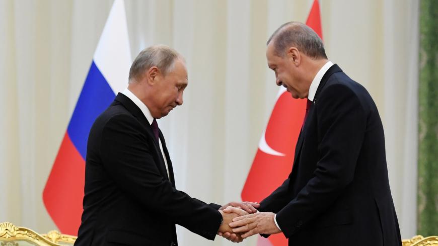 Russian President Vladimir Putin shakes hands with his Turkish counterpart Tayyip Erdogan during their meeting in Tehran, Iran September 7, 2018. Kirill Kudryavtsev/Pool via REUTERS - RC11E2DD7470