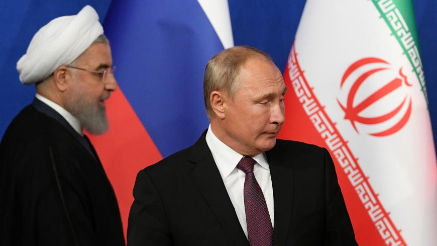 Iranian President Hassan Rouhani and his Russian counterpart Vladimir Putin arrive for a news conference following their meeting in Tehran, Iran September 7, 2018. Kirill Kudryavtsev/Pool via REUTERS - RC1D3DE44960