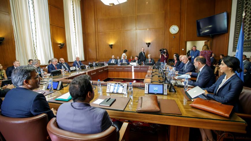 Iran's Deputy Foreign Minister Hossein Jaberi Ansari, Russia's special envoy on Syria Alexander Lavrentiev, Turkish Deputy Foreign Minister Sedat Onal, and U.N. Special Envoy for Syria Staffan de Mistura attend a meeting during consultations on Syria at the European headquarters of the United Nations in Geneva, Switzerland September 11, 2018. Salvatore Di Nolfi/Pool via REUTERS - RC1A114E23C0