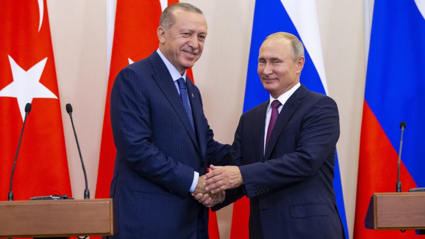 Russian President Vladimir Putin (R) and his Turkish counterpart Tayyip Erdogan shake hands during a news conference following their talks in Sochi, Russia September 17, 2018. Alexander Zemlianichenko/Pool via REUTERS - UP1EE9H1AUD0U