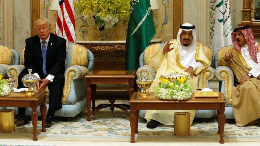 U.S. President Donald Trump (L) waits for the start of an event with Saudi Arabia's King Salman bin Abdulaziz Al Saud (2-R) and Gulf Cooperation Council leaders at their summit in Riyadh, Saudi Arabia May 21, 2017. REUTERS/Jonathan Ernst - RC17B78F1020