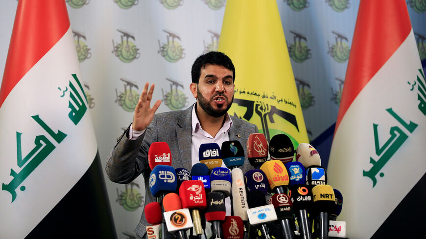 Hashim al-Mousawi, the official spokesman for Harakat Hezbollah al Nujaba, speaks during a news conference in Baghdad, Iraq November 23, 2017. REUTERS/Thaier Al-Sudani - RC18066A05E0