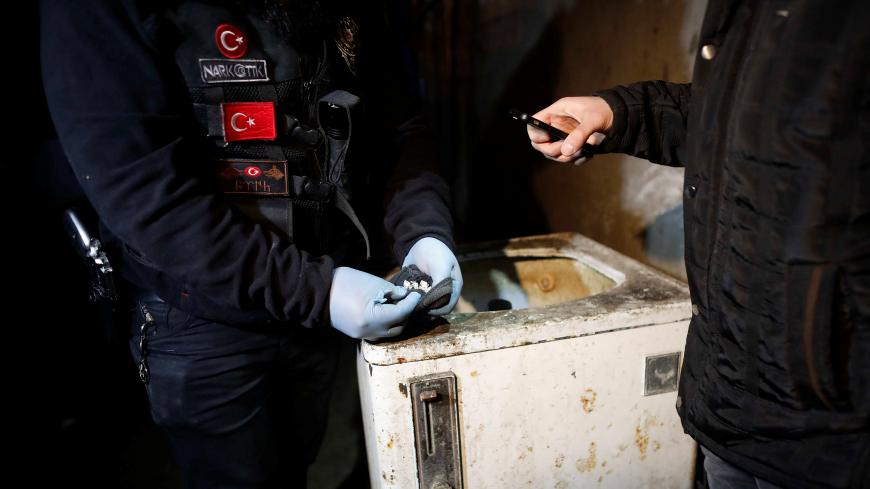 Turkish anti-narcotics police officers search a house during a drug raid in Istanbul, Turkey, January 16, 2018. REUTERS/Osman Orsal - RC1ED4104A00