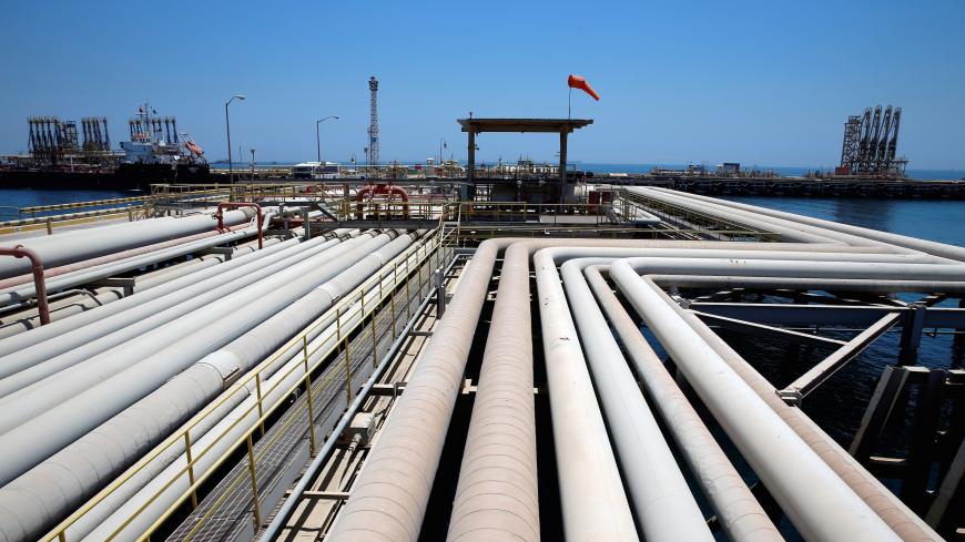 An oil tanker is being loaded at Saudi Aramco's Ras Tanura oil refinery and oil terminal in Saudi Arabia May 21, 2018. Picture taken May 21, 2018. REUTERS/Ahmed Jadallah - RC1974EF8830