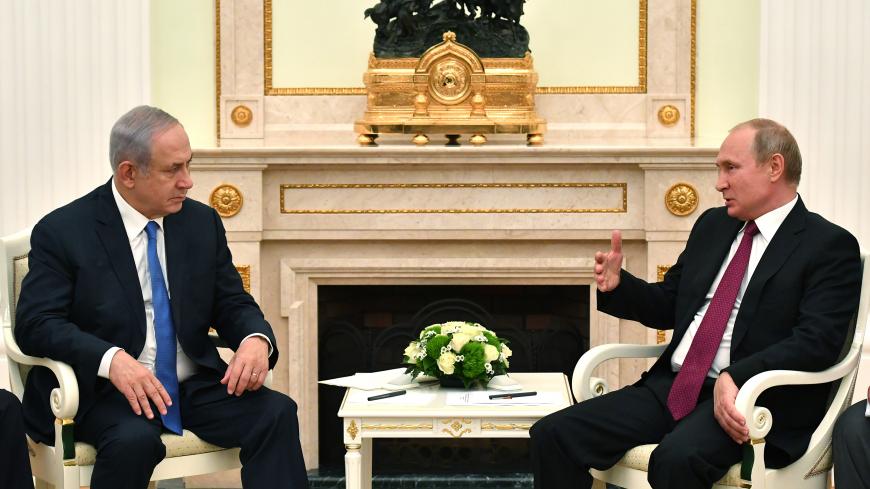 Russian President Vladimir Putin speaks with Israeli Prime Minister Benjamin Netanyahu during their meeting at the Kremlin in Moscow, Russia July 11, 2018. Yuri Kadobnov/Pool via REUTERS - UP1EE7B1DI9W0