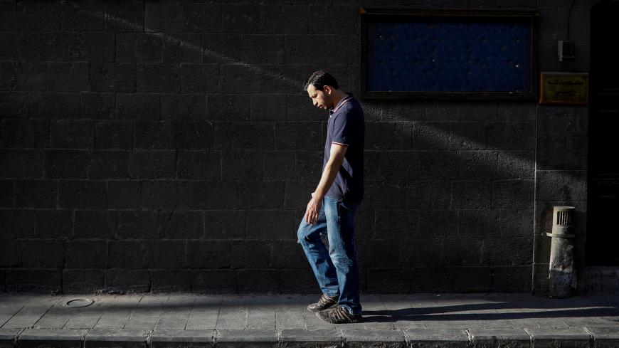 A man walks through the old city of Damascus, Syria, September 12, 2018. Picture taken September 12, 2018. REUTERS/Marko Djurica      TPX IMAGES OF THE DAY - RC1AD454BD80