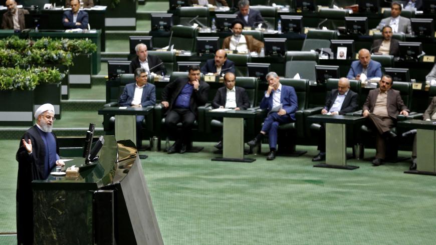 President Hassan Rouhani speaks at the Iranian Parliament in the capital Tehran, on August 28, 2018. - It was the first time Rouhani had been summoned by parliament in his five years in power, with MPs demanding answers on unemployment, rising prices and the collapsing value of the rial, which has lost more than half its value since April. (Photo by ATTA KENARE / AFP)        (Photo credit should read ATTA KENARE/AFP/Getty Images)