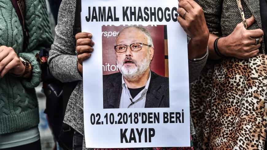 A woman holds a portrait of missing journalist and Riyadh critic Jamal Khashoggi reading "Jamal Khashoggi is missing since October 2" during a demonstration in front of the Saudi Arabian consulate on October 9, 2018 in Istanbul. - Khashoggi, a Washington Post contributor, vanished last on October 2 after entering the Saudi Arabian consulate to receive official documents ahead of his marriage to a Turkish woman. A Turkish government source told AFP at the weekend that the police believe the journalist "was k