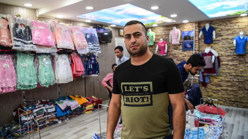 A Syrian shop owner, Mustafa Turkmen, poses during an interview on May 1, 2018 in Gaziantep, southwestern Turkey. - In the Turkish city of Gaziantep, home to around half a million Syrians who fled the civil war south of the border, hundreds of Syrian businesses are thriving in a boost both for the displaced community and their host country. (Photo by OZAN KOSE / AFP)        (Photo credit should read OZAN KOSE/AFP/Getty Images)