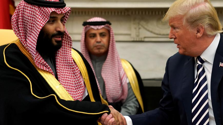 U.S. President Donald Trump shakes hands with Saudi Arabia's Crown Prince Mohammed bin Salman in the Oval Office at the White House in Washington, U.S. March 20, 2018.  REUTERS/Jonathan Ernst - RC16218400E0