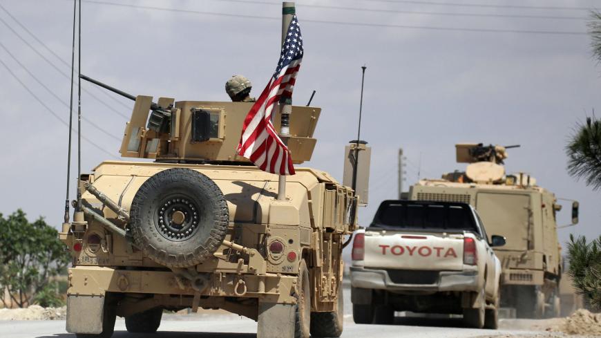 The U.S. flag flutters on a military vehicle in Manbej countryside, Syria May 12, 2018. REUTERS/Aboud Hamam - RC1B2D4114E0