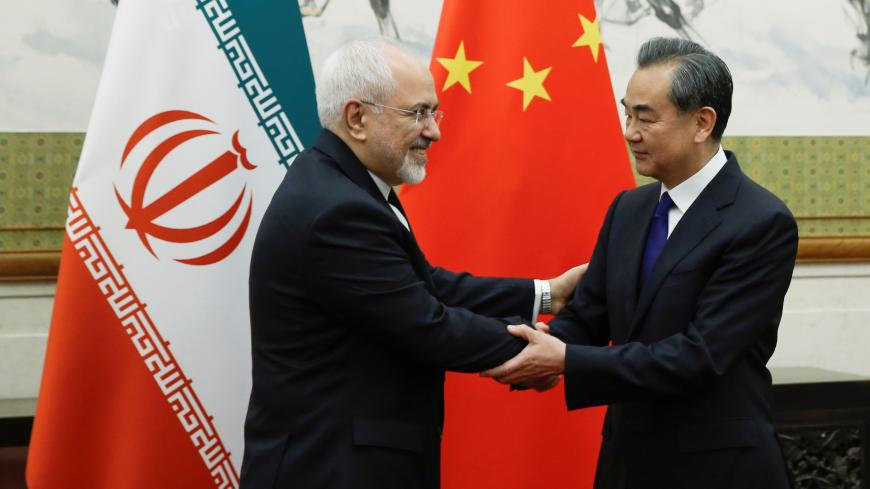 Chinese State Councillor and Foreign Minister Wang Yi meets Iranian Foreign Minister Mohammad Javad Zarif at Diaoyutai state guesthouse in Beijing, China May 13, 2018. REUTERS/Thomas Peter - RC1EE6C163D0