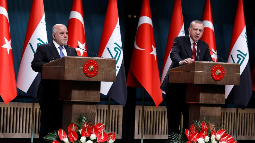 Turkish President Tayyip Erdogan and Iraqi Prime Minister Haider al-Abadi attend a news conference in Ankara, Turkey, August 14, 2018. REUTERS/Umit Bektas - RC1274635EE0