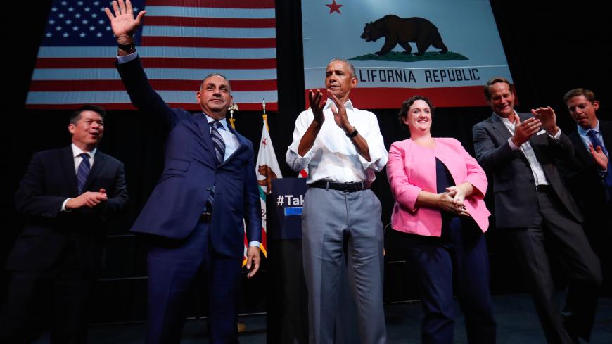 Former U.S. President Barack Obama participates in a political rally for California Democratic candidates during a event in Anaheim, California, U.S., September 8, 2018. Left to right are candidates TJ Cox (CA-21), Gil Cisneros (CA-39), Katie Porter (CA-45), Harley Rouda (CA-48) and Mike Levin (CA-49). REUTERS/Mike Blake - RC1C008C89B0