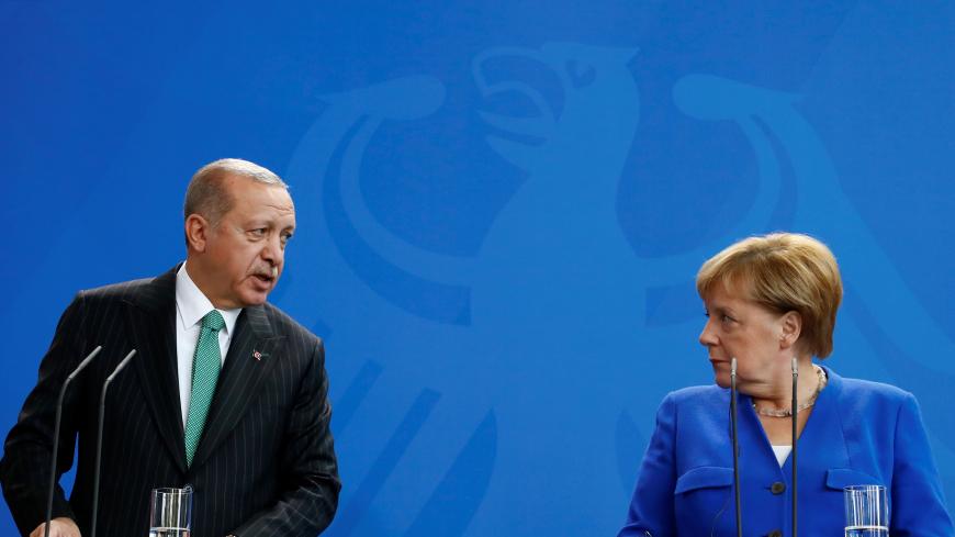 German Chancellor Angela Merkel and Turkish President Tayyip Erdogan address a news conference at the chancellery in Berlin, Germany, September 28, 2018. REUTERS/Fabrizio Bensch - RC1161597F70