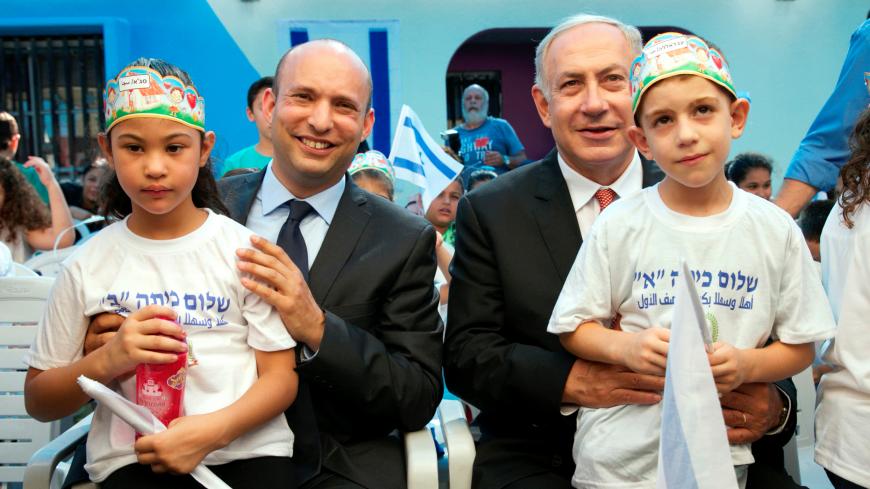 Israeli Prime Minister Benjamin Netanyahu (R) and Education Minister Naftali Bennett with pupils during a visit at the "Tamra HaEmek" elementary school on the first day of the school year, in the Arab Israeli town of Tamra, Israel September 1, 2016. REUTERS/Baz Ratner - S1AETYTKZEAA