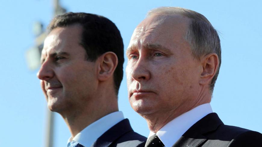 Russian President Vladimir Putin (R) and Syrian President Bashar al-Assad visit the Hmeymim air base in Latakia Province, Syria December 11, 2017. Picture taken December 11, 2017. To match Special Report RUSSIA-FLIGHTS/ Sputnik/Mikhail Klimentyev/ via REUTERS/File Photo  ATTENTION EDITORS - THIS IMAGE WAS PROVIDED BY A THIRD PARTY. - RC1DE7734AA0