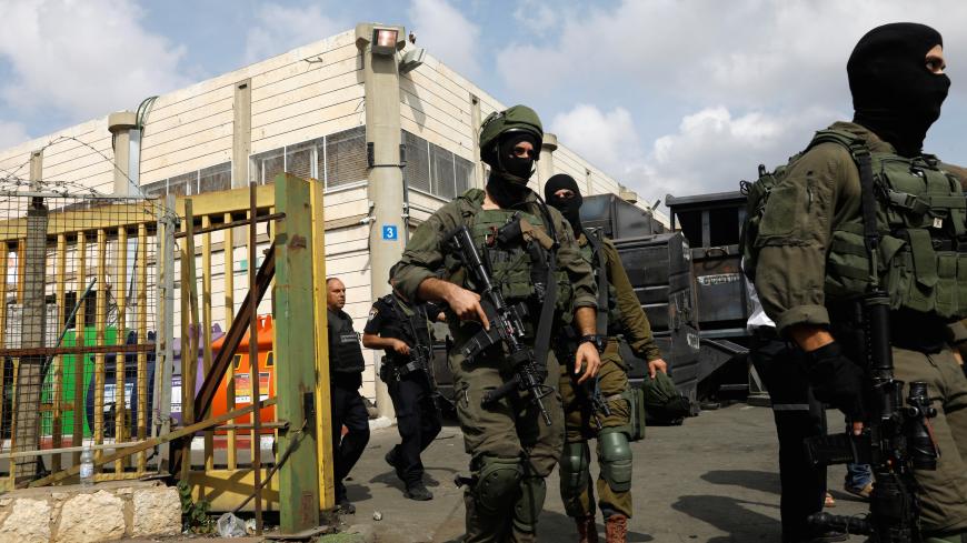 Israeli soldiers patrol near the scene where, according to Israeli media, a Palestinian shot and wounded three Israelis, at an industrial park adjacent to a Jewish settlement in the occupied West Bank October 7, 2018. REUTERS/Ronen Zvulun - RC156539A780
