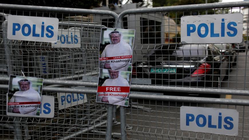 Pictures of Saudi journalist Khashoggi are placed on security barriers during a protest outside the Saudi Consulate in Istanbul, Turkey October 8, 2018. REUTERS/Murad Sezer - RC1FD8B03460