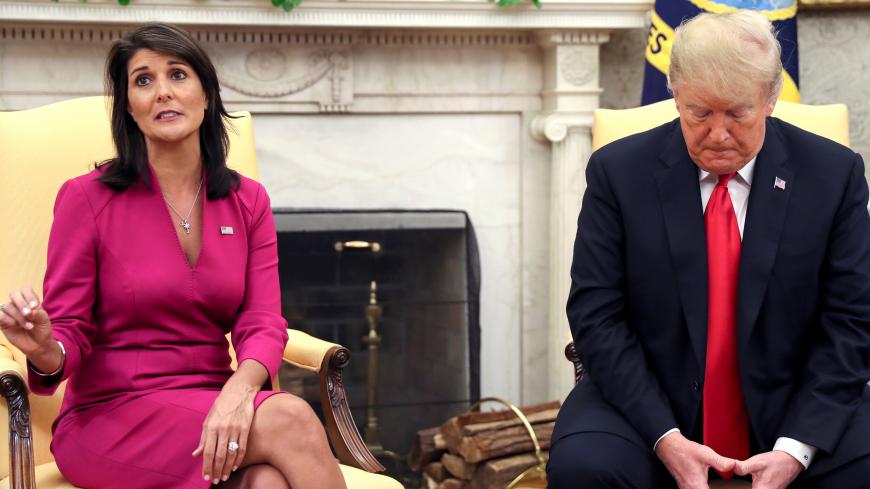 Outgoing U.S. Ambassador to the United Nations Nikki Haley talks with U.S. President Donald Trump in the Oval Office of the White House after the president accepted Haley's resignation in Washington, U.S., October 9, 2018. REUTERS/Jonathan Ernst - RC1DE84AD970