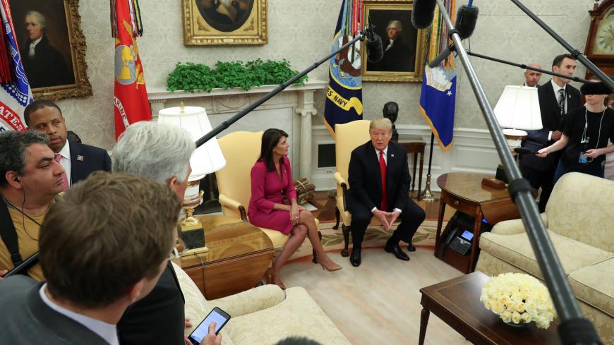 U.S. President Donald Trump talks with U.N. Ambassador Nikki Haley in the Oval Office of the White House after it was announced the president had accepted the Haley's resignation in Washington, U.S., October 9, 2018. REUTERS/Jonathan Ernst - RC1E7B6A6960