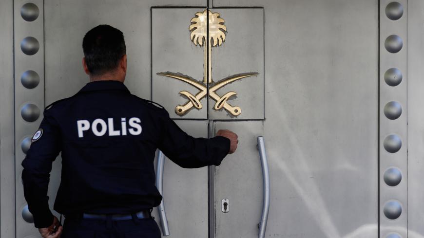 A Turkish police officer who stands guard at the Saudi Arabia's consulate is seen at the entrance, in Istanbul, Turkey October 10, 2018. REUTERS/Murad Sezer - RC133B501BB0