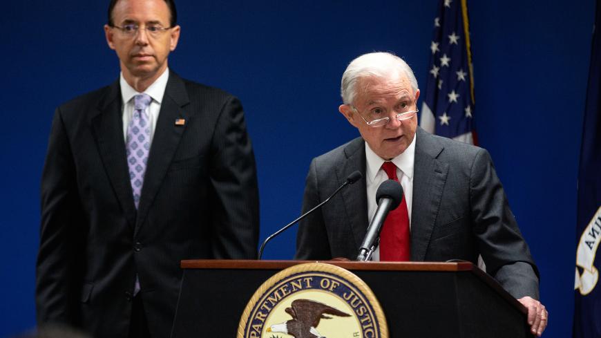 U.S. Attorney General Jeff Sessions speaks alongside Deputy Attorney General Rod Rosenstein during a news conference to announce efforts to reduce transnational crime, at the U.S. District Attorney's office, in Washington, U.S., October 15, 2018. REUTERS/Al Drago - RC17479B8800
