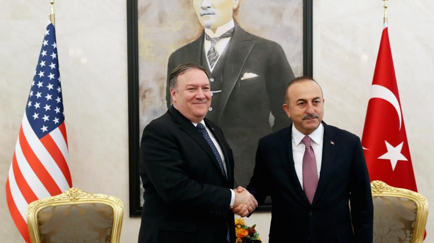 U.S. Secretary of State Mike Pompeo greets Turkish Foreign Minister Mevlut Cavusoglu before their meeting in Ankara, Turkey, October 17, 2018. REUTERS/Leah Millis/Pool - RC19DE45A2A0