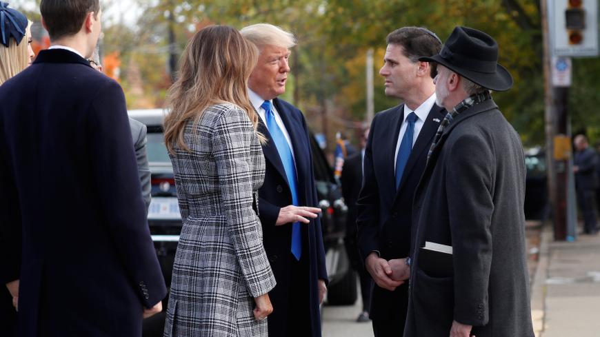 U.S. President Donald Trump talks with Israeli Ambassador to the U.S. Ron Dermer and Tree of Life Synagogue Rabbi Jeffrey Myers as he arrives with (L-R) his daughter Ivanka Trump, son-in-law Jared Kushner and first lady Melania Trump outside the synagogue where a gunman killed eleven people and wounded six during a mass shooting Saturday in Pittsburgh, Pennsylvania, U.S., October 30, 2018. REUTERS/Kevin Lamarque - RC1951277440