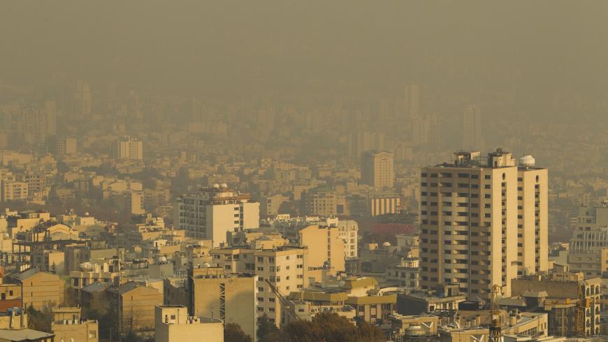 A general view shows smog over northwestern Tehran November 23, 2010. Tehran is choking. Gridlock on urban highways makes the city feel more like Los Angeles than the Middle East, while adding a toxic yellow halo of smog to otherwise perennially blue skies. Picture taken November 23, 2010. To match feature IRAN-METRO/  REUTERS/Raheb Homavandi (IRAN - Tags: ENVIRONMENT TRANSPORT CITYSCAPE) - GM1E6C800LV01