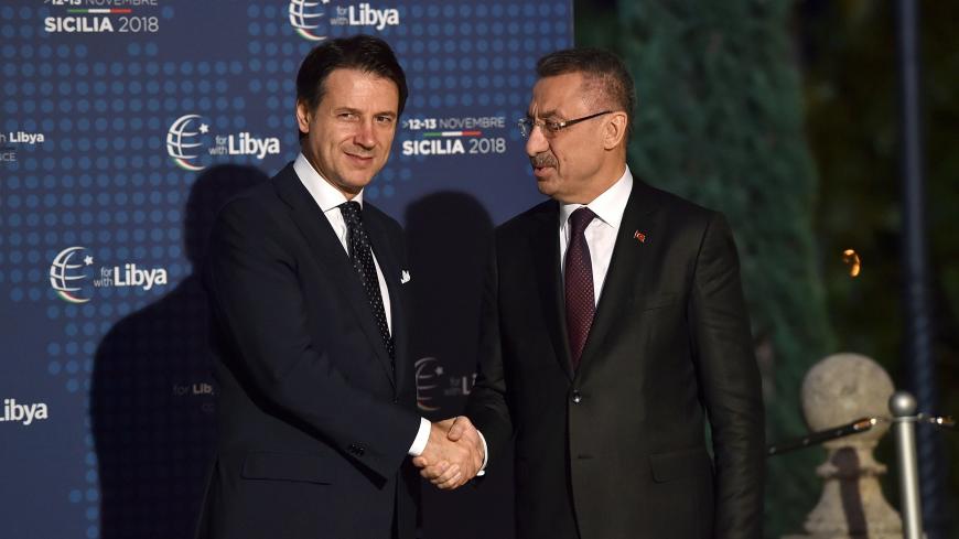 PALERMO, ITALY - NOVEMBER 12:  Italian Prime Minister Giuseppe Conte welcomes Fuat Oktay, Vice President of Turkey during the Conference for Libya at Villa Igiea on November 12, 2018 in Palermo, Italy. Heads of State, ministers and special envoys are holding a two day meeting where they will discuss about security and stability in Libya.  (Photo by Tullio Puglia/Getty Images)