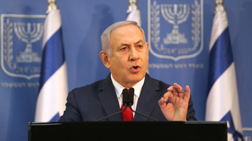Israel's Prime Minister Benjamin Netanyahu delivers a statement to the members of the media in Tel Aviv, Israel November 18, 2018. REUTERS/Corinna Kern - RC1117126B60