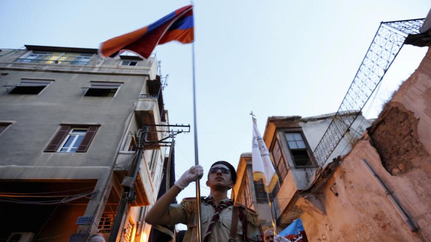 Demonstrators march carrying flags to commemorate the 101st anniversary of the mass killing of Armenians by Ottoman Turks in Damascus, Syria April 22, 2016. REUTERS/Omar Sanadiki - GF10000392605
