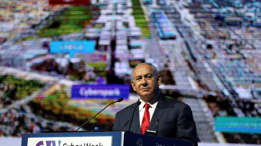 Israeli Prime Minister Benjamin Netanyahu speaks during the Cyber Week conference at Tel Aviv University, Israel, June 20, 2018. REUTERS/Ammar Awad - RC15B2CE7200