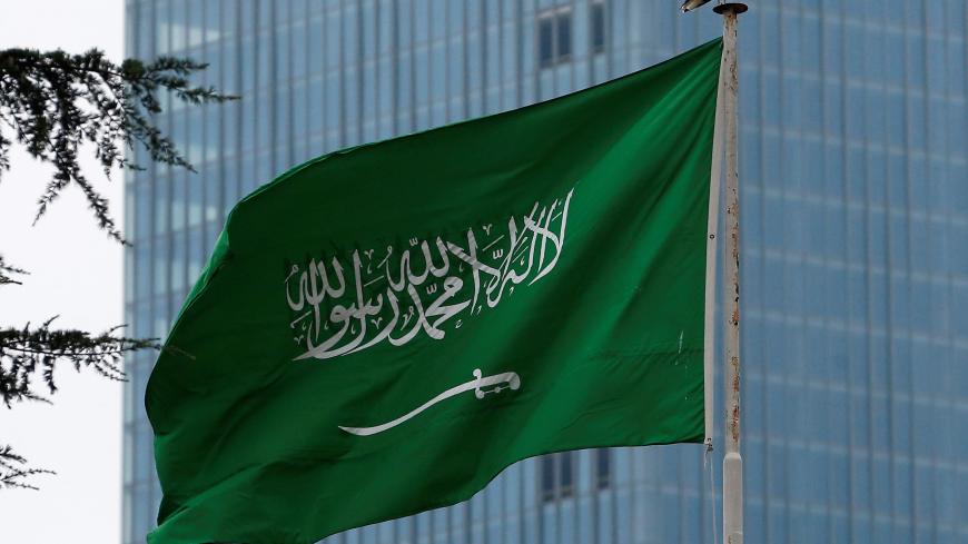 A Saudi flag flutters atop Saudi Arabia's consulate in Istanbul, Turkey October 20, 2018. REUTERS/Huseyin Aldemir - RC14ECA7C770