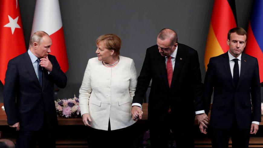 German Chancellor Angela Merkel, Russian President Vladimir Putin, Turkish President Tayyip Erdogan and French President Emmanuel Macron pose after a news conference at the Syria summit in Istanbul, Turkey, October 27 2018.   Maxim Shipenkov/Pool via REUTERS - RC18F59FDC40