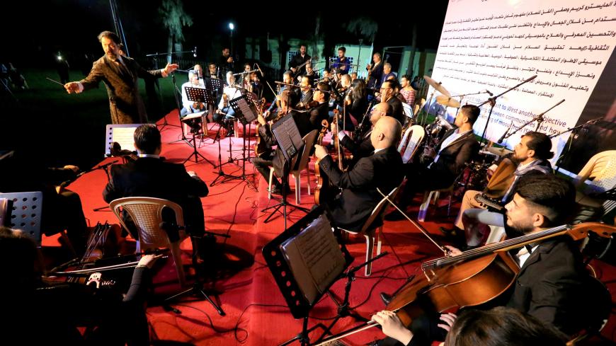 REFILE - CORRECTING ORCHESTRA NAME Conductor Karim Wasfi leads the Peace Through Arts Farabi Orchestra during a concert in Mosul, Iraq October 27, 2018. Picture taken October 27, 2018. REUTERS/Ari Jalal - RC11765B9AD0