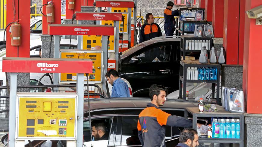 Iranians drivers fill their tanks at a gas station in the capital Tehran on November 5, 2018. - Iran's President Hassan Rouhani said the Islamic republic "will proudly bypass sanctions" by the United States that took effect on Monday targeting the country's oil and financial sectors. (Photo by ATTA KENARE / AFP)        (Photo credit should read ATTA KENARE/AFP/Getty Images)