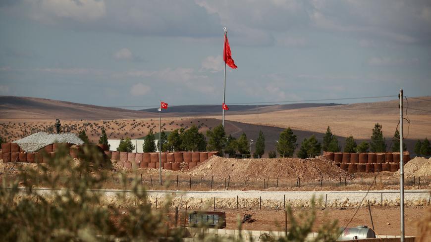 A general view shows Turkish flags fluttering at a military post in the village of Ashma in the Kurdish region of Kobane in northern Syria on November 8, 2018. - In recent days, cross-border Turkish artillery fire has targeted positions held by the People's Protection Units (YPG), the main Kurdish militia in Syria. Ankara sees the de-facto autonomous rule set up by Syrian Kurds as an encouragement to the separatists of the Turkey-based Kurdistan Workers' Party (PKK), which has close ties to the YPG. (Photo 