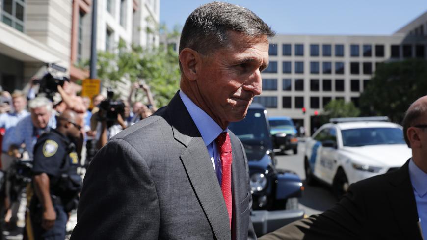WASHINGTON, DC - July 10: Michael Flynn, former National Security Advisor to President Donald Trump, departs the E. Barrett Prettyman United States Courthouse following a pre-sentencing hearing July 10, 2018 in Washington, DC. Flynn has been charged with a single count of making a false statement to the FBI by Special Counsel Robert Mueller. (Photo by Aaron P. Bernstein/Getty Images)