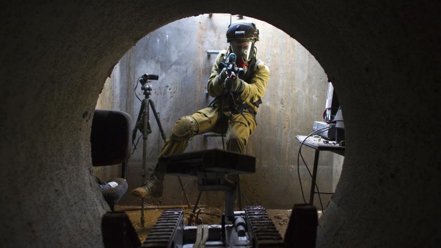 An Israeli commando from the engineering corps Yahalom ("Diamond") unit takes part in a tunnel-hunting drill in Sirkin special forces base, near Tel Aviv March 7, 2012. Israel, fearing a surge in tunnel and bunker construction by Hezbollah and Palestinian militants in neighbouring Lebanon and Gaza, is training crack troops to hunt below ground with the help of robot probes and sniffer dogs. REUTERS/Nir Elias (ISRAEL - Tags: POLITICS MILITARY) - GM1E83802EC01