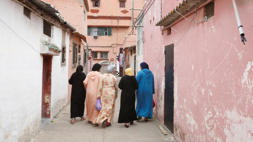 Moroccan women walk along a narrow street in Mohamadia, Morocco, April 28, 2018. Picture taken April 28, 2018. REUTERS/Youssef Boudlal - RC136B5110C0