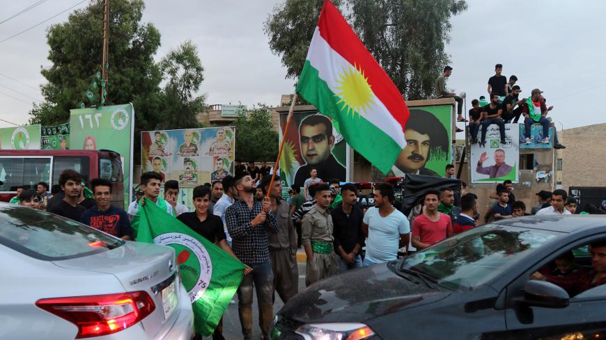Kurdish supporters of the Patriotic Union of Kurdistan (PUK) celebrate after the closing of ballot boxes during the parliamentary election in Kirkuk, Iraq, May 12, 2018. REUTERS/Ako Rasheed - RC1D42ED63F0