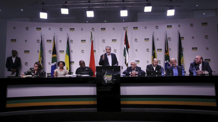 Hama chief Khaled Meshaal (C) addresses a media briefing at the headquarters of South Africa's ruling African National Congress (ANC) in Johannesburg, October 19, 2015. Meshaal and a delegation from Palestine are in South Africa at the invitation of the ANC. REUTERS/Siphiwe Sibeko  - GF10000250928