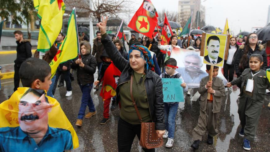 Kurdish demonstrators hold flags during a protest demanding the release of the Kurdistan Workers Party (PKK) leader Abdullah Ocalan, in Sulaimaniyah, Iraq February 16, 2018. REUTERS/Ako Rasheed - RC1EA9AA5C90