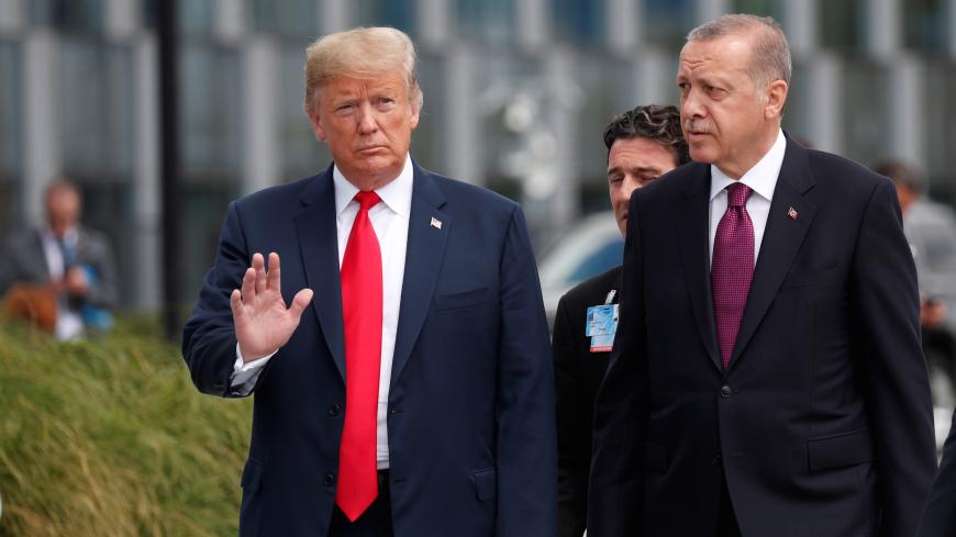 U.S. President Donald Trump and Turkish President Tayyip Erdogan attend the start of the NATO summit in Brussels, Belgium July 11, 2018.  REUTERS/Kevin Lamarque - RC117DD2EDF0