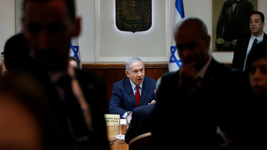 Israeli Prime Minister Benjamin Netanyahu chairs the weekly cabinet meeting at his office in Jerusalem December 9, 2018. Oded Balilty/Pool via REUTERS - RC134DA41BD0