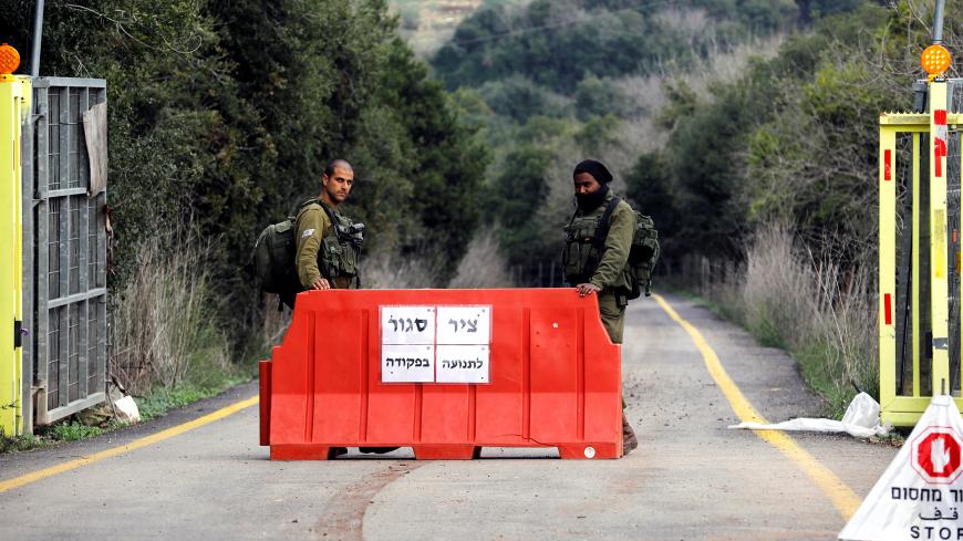 Israeli soldiers stand guard at a check-point on a raod leading to the border line between Israel and Lebanon, on the Israeli side of the border December 9, 2018. REUTERS/Amir Cohen - RC11450F0E90
